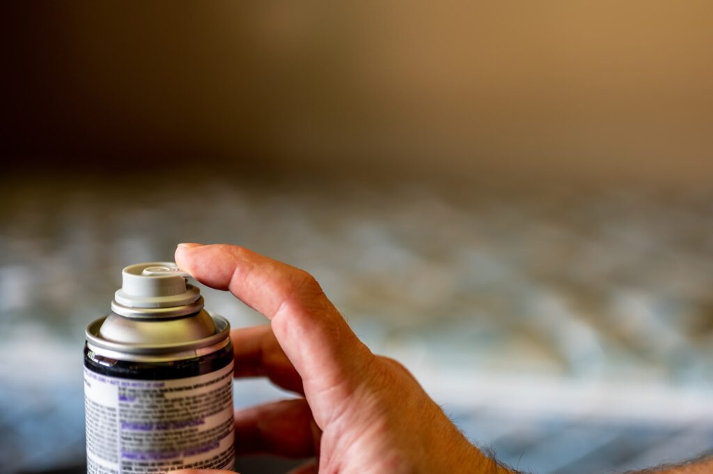 Home owner spraying flea bombs